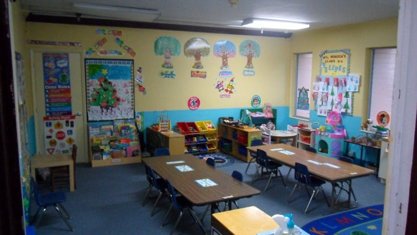 Classroom with tables and chairs, decorated walls