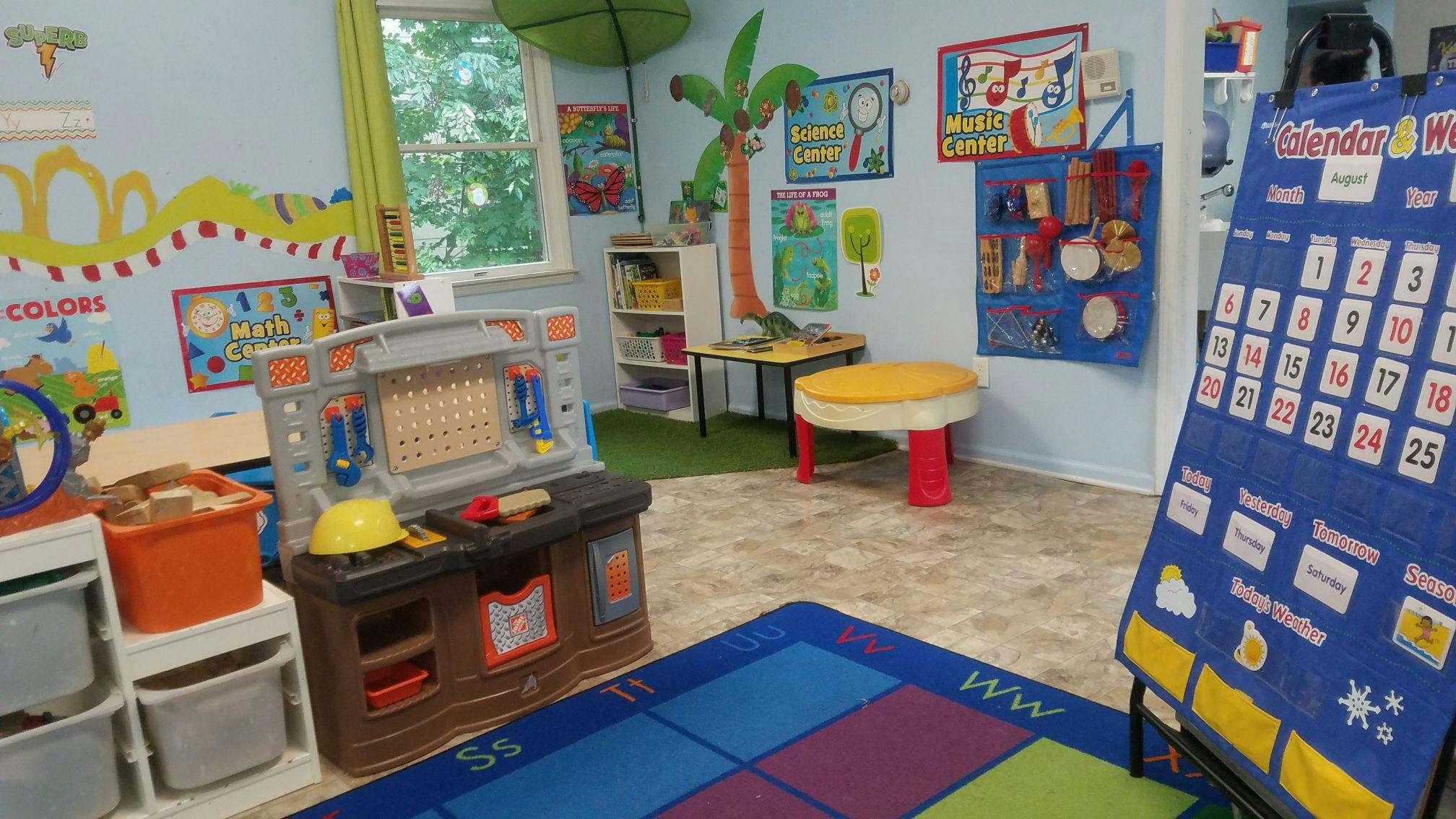 Playroom with a toy workbench and a calendar chart