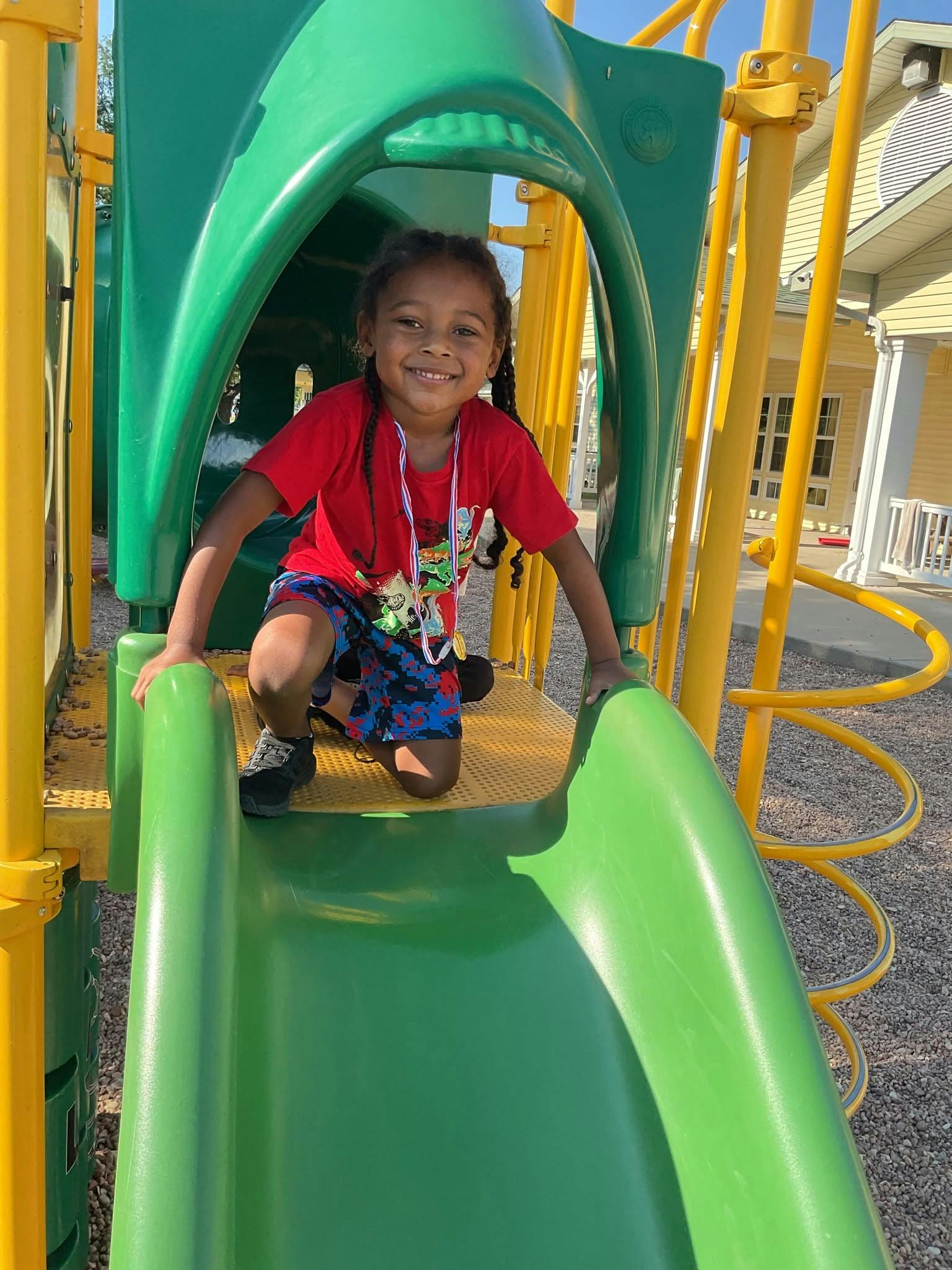 Child on a playground slide