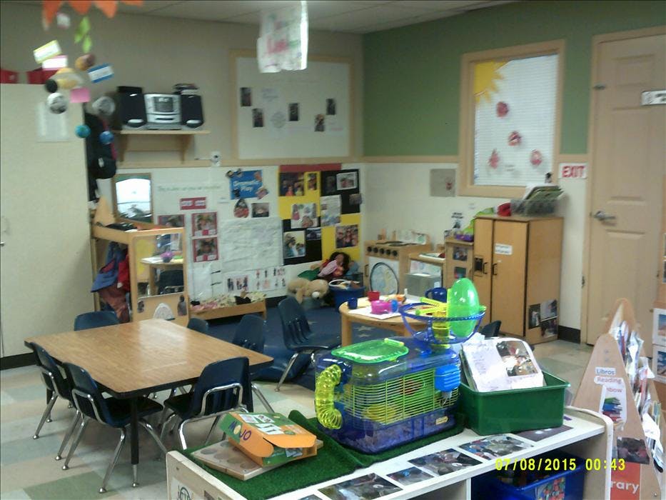 Classroom with tables, chairs, and learning materials