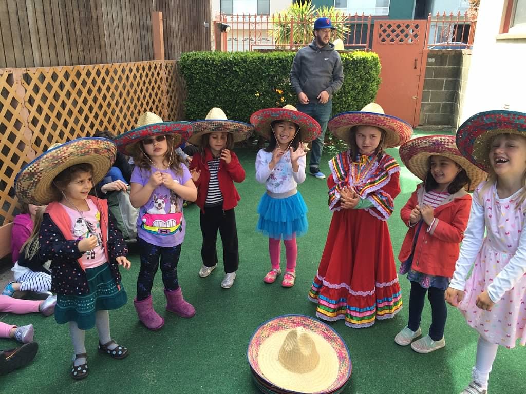 Children in sombreros and traditional dresses