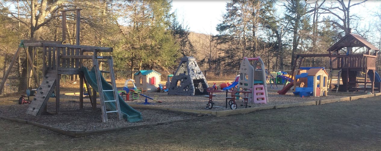 Playground with multiple slides, swings, and climbing structures