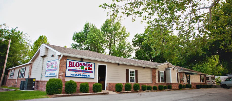 Blossom sign on the side of a building