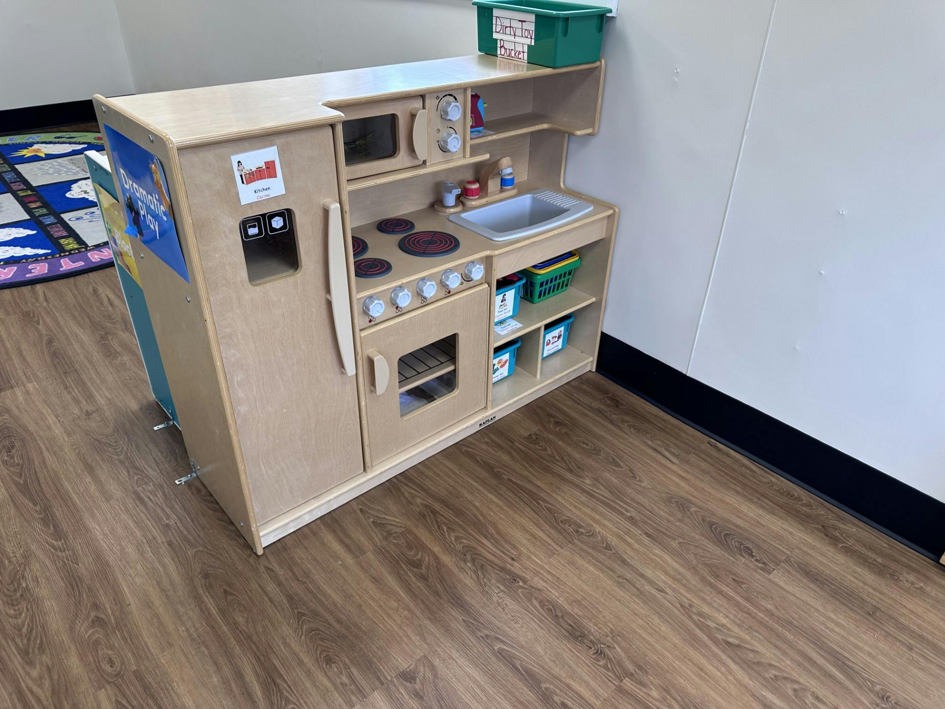 wooden toy kitchen set in a classroom