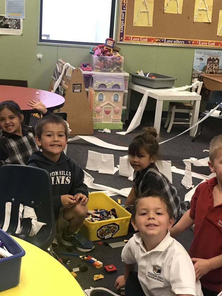 Children playing on the floor in a classroom