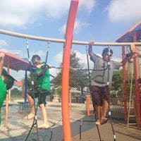 Two people on a rope climbing structure