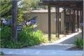 Path leading to a building with an overhang