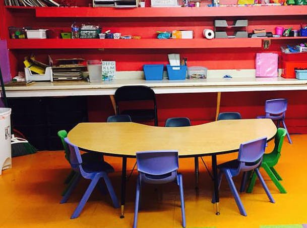 Classroom with a curved table and chairs