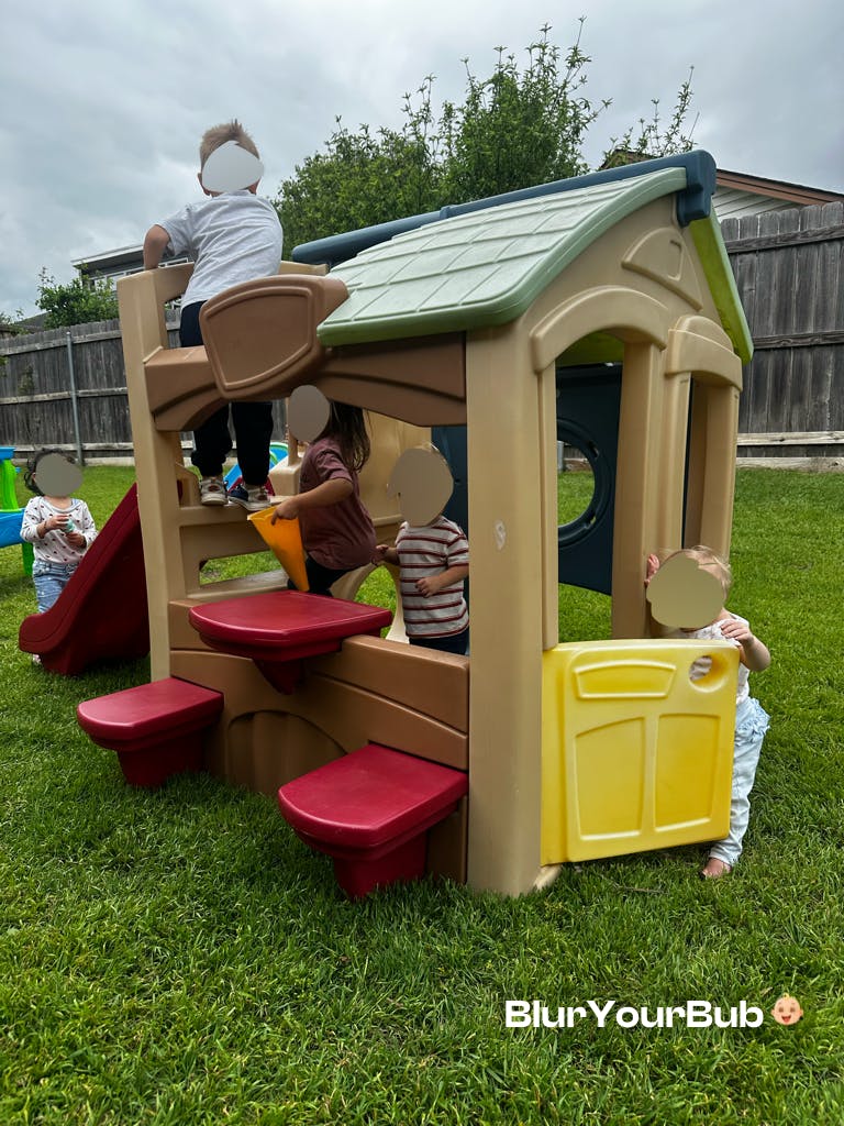 Children playing on a backyard playset