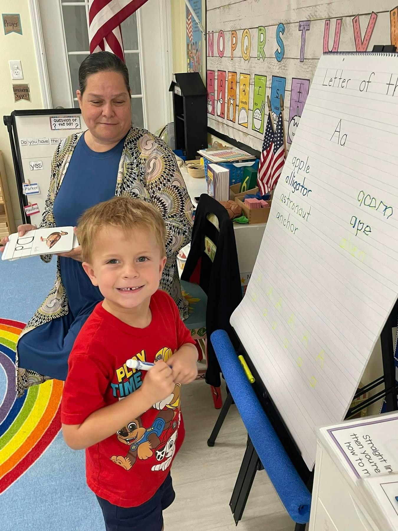 Adult and child in a classroom