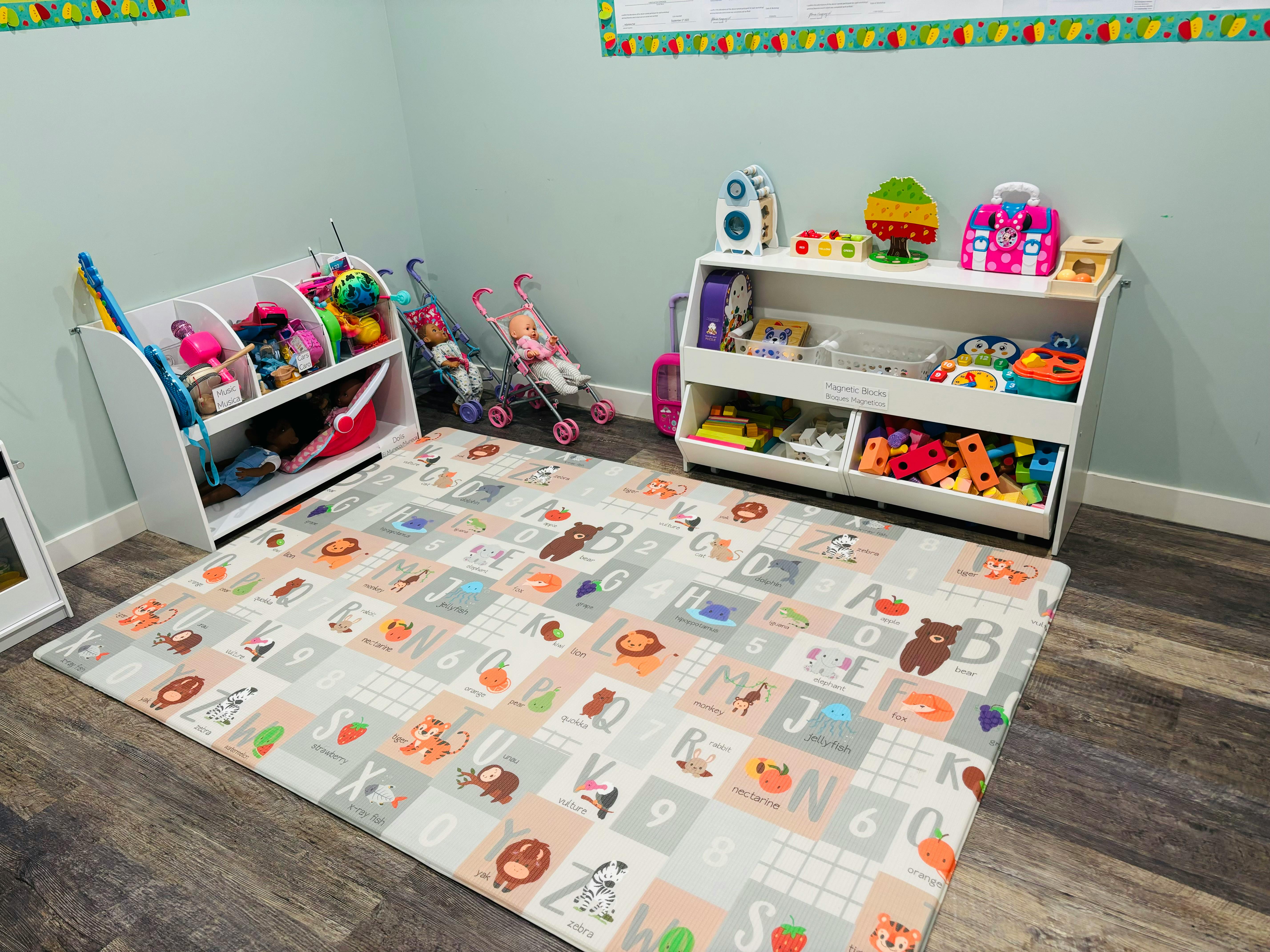 Playroom with toy shelves and an alphabet playmat