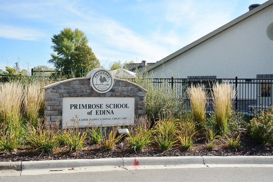 Stone sign for Primrose School of Edina with landscaping