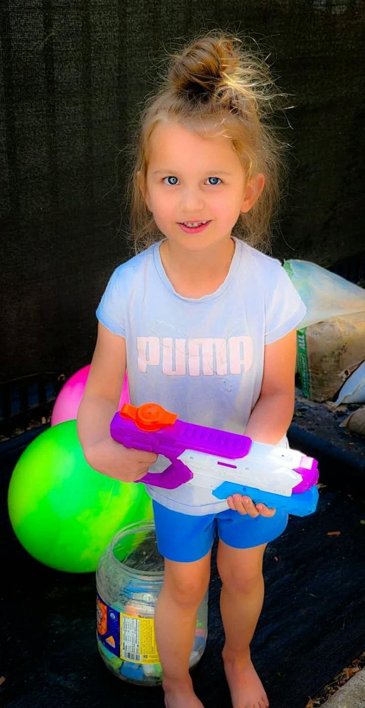 Child holding a water gun