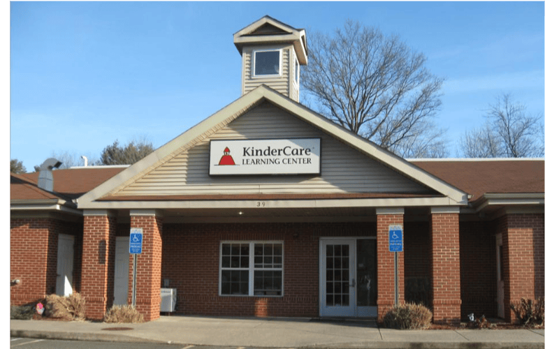 KinderCare Learning Center sign on a brick building with columns