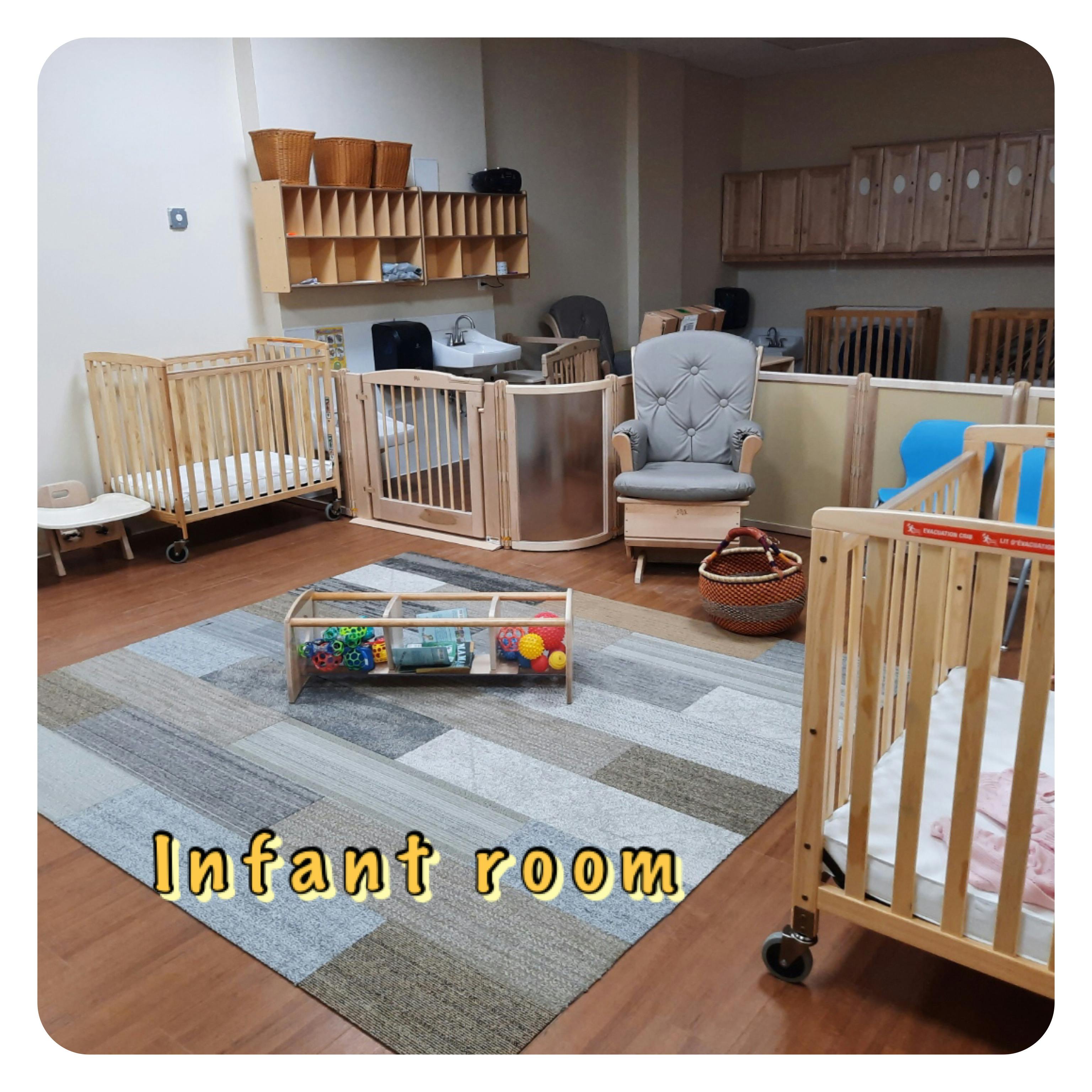 Infant room with cribs, a rocking chair, and a play mat