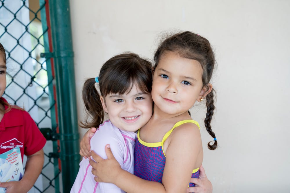Two children embracing