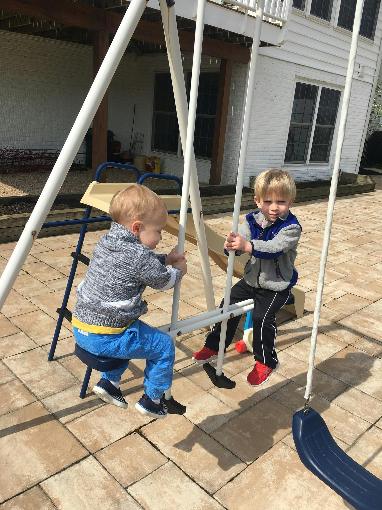Two children on a swing set