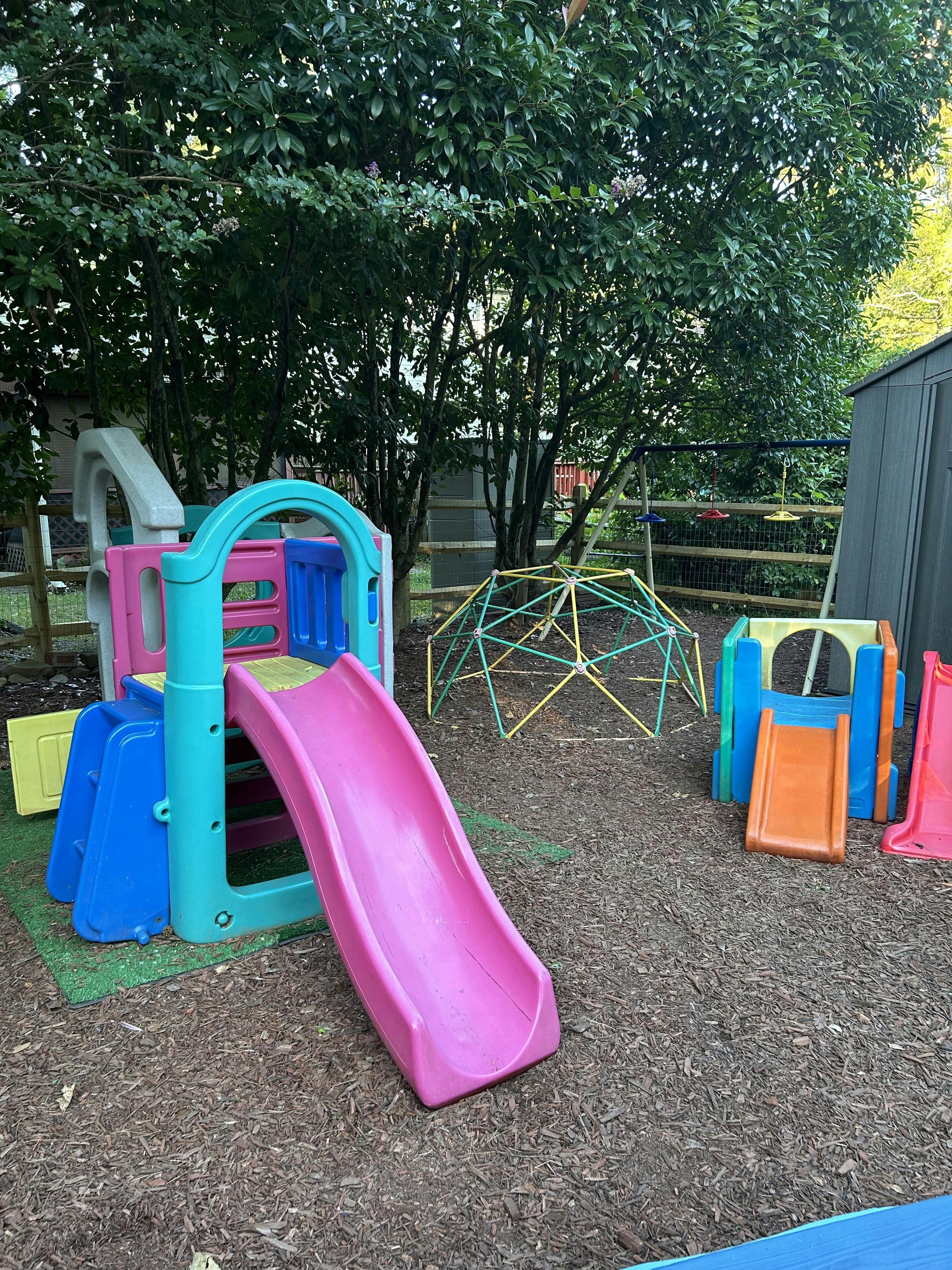 Playground with colorful slides and climbing dome