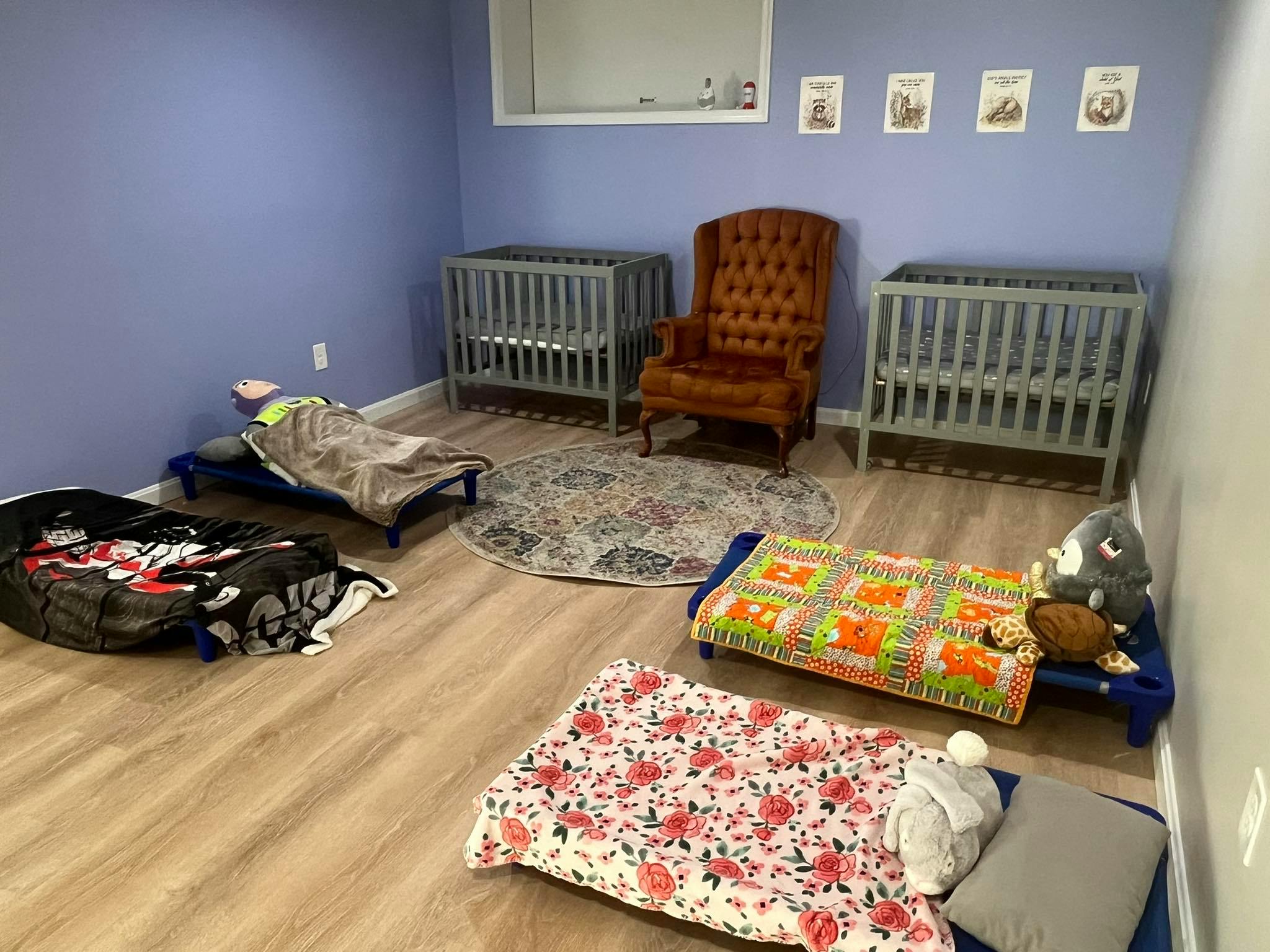 Room with cribs and floor beds