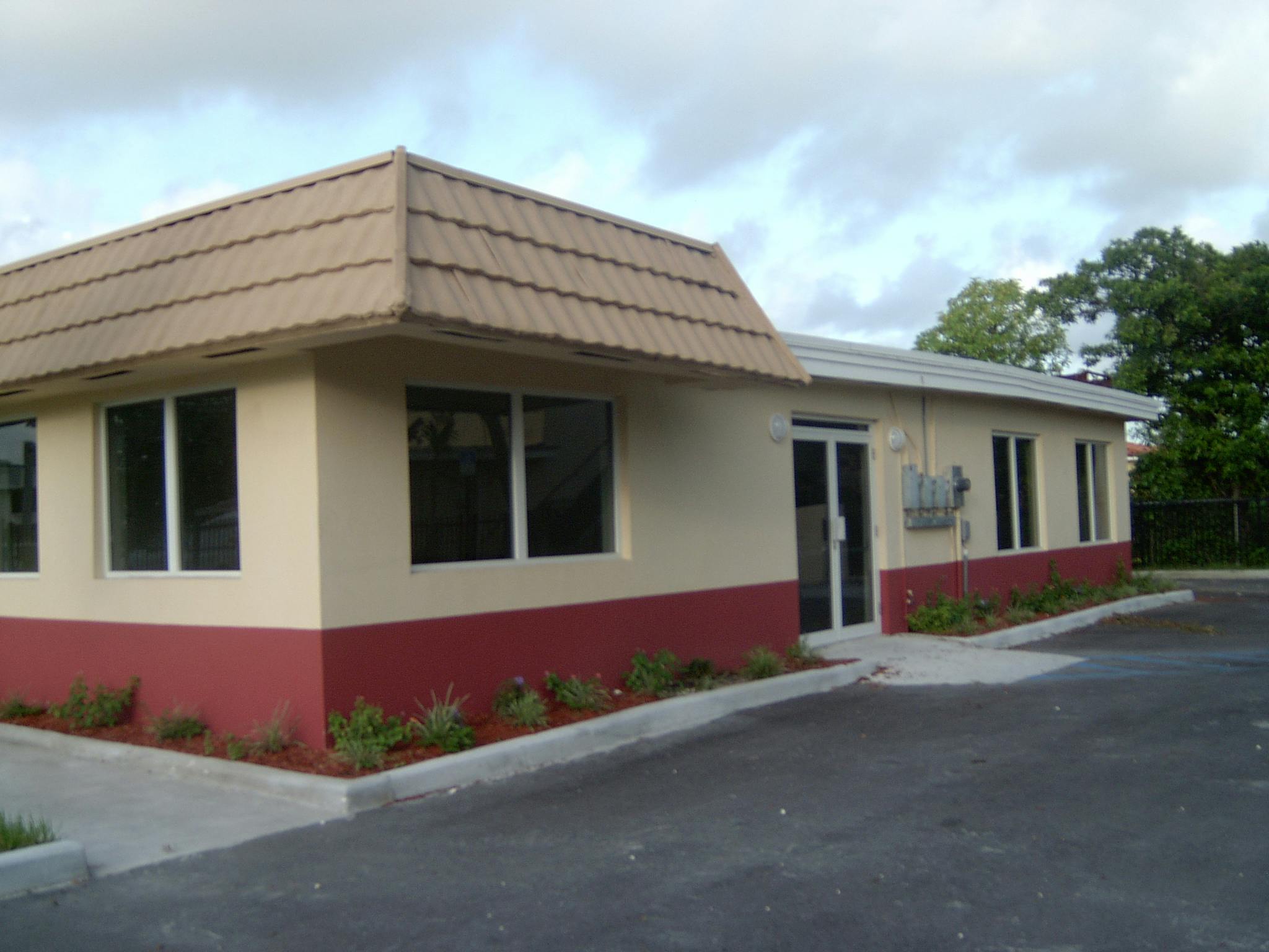 Exterior of a building with a red and tan facade