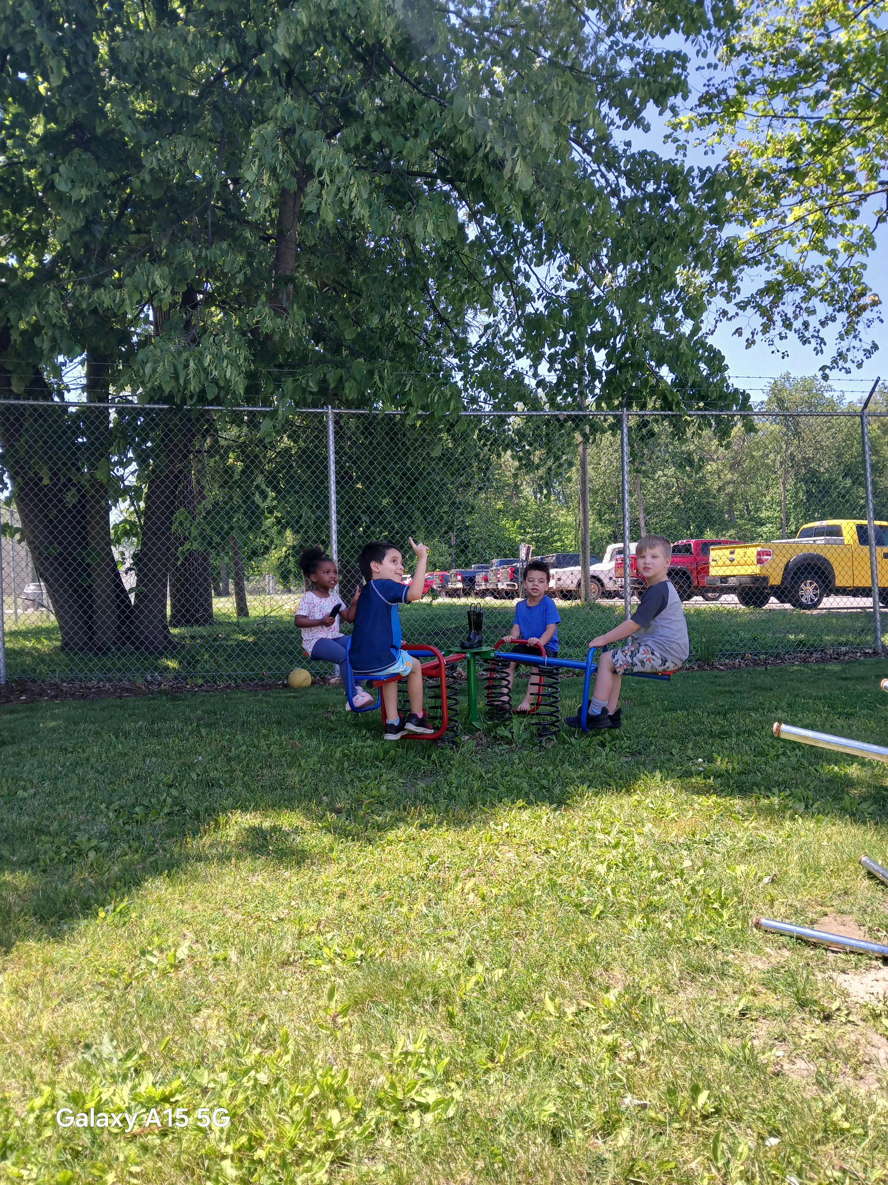 children on spring riders at a playground