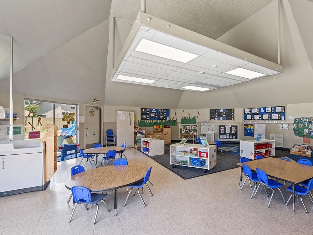 Classroom with child-sized tables and chairs