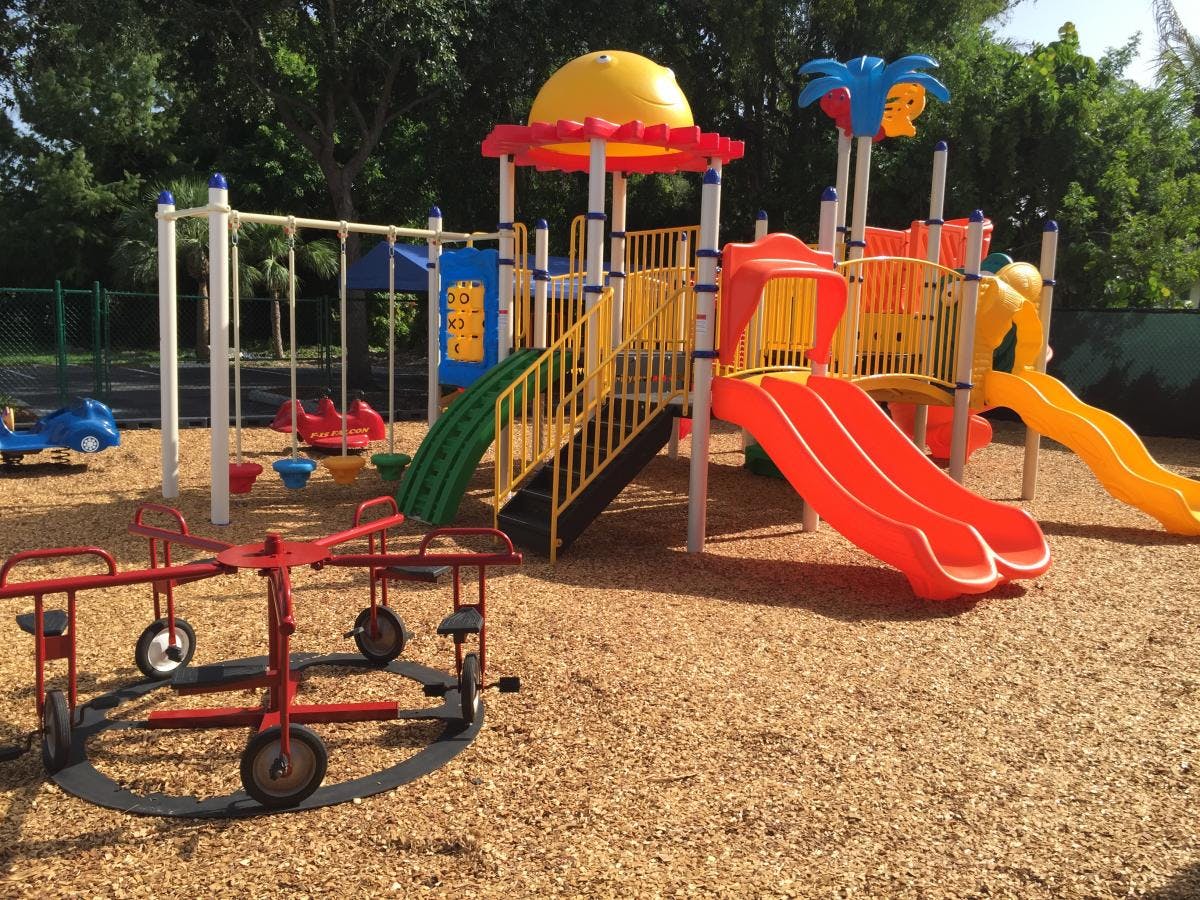 Playground with slides, swings, and a merry-go-round