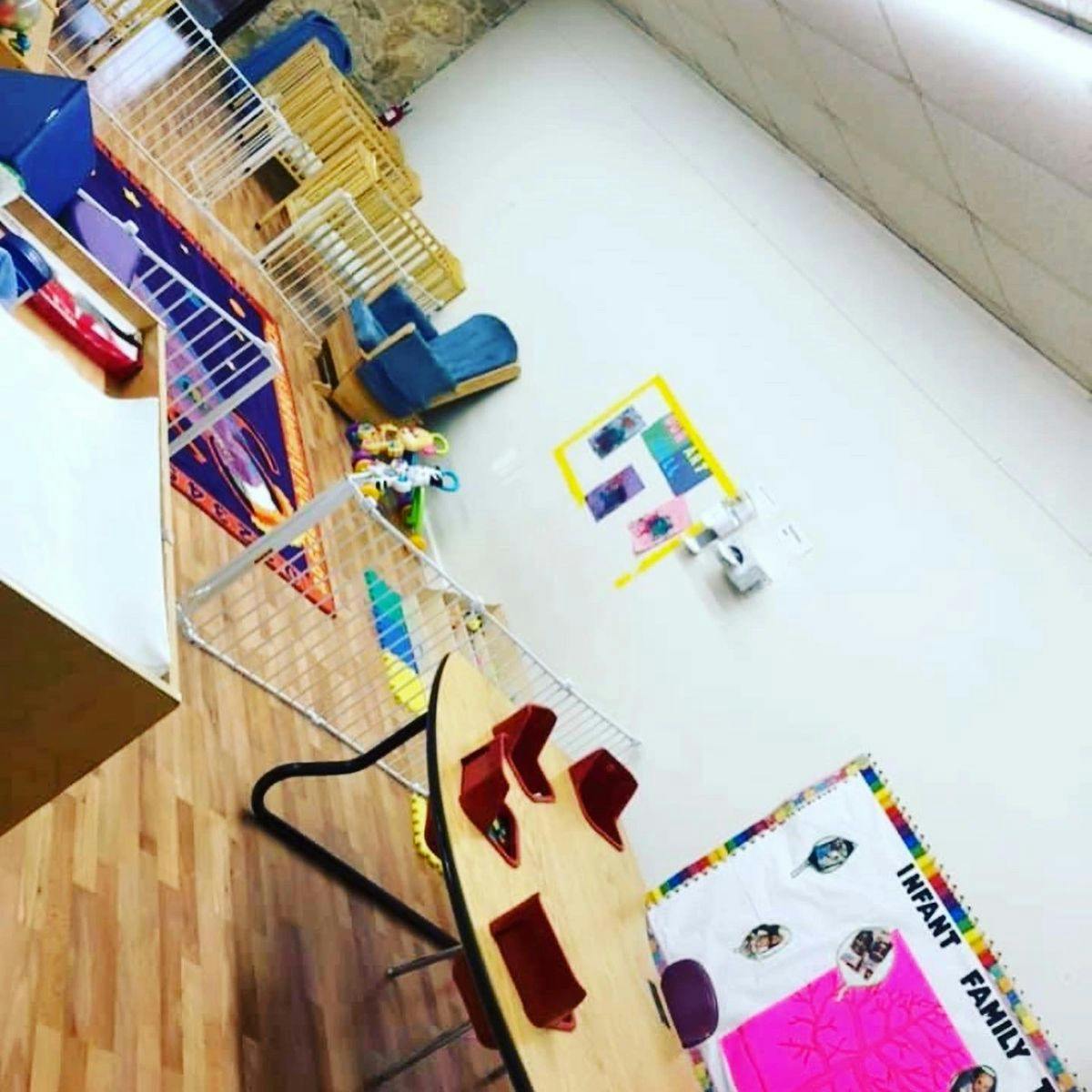Classroom with small chairs, tables, and colorful decorations