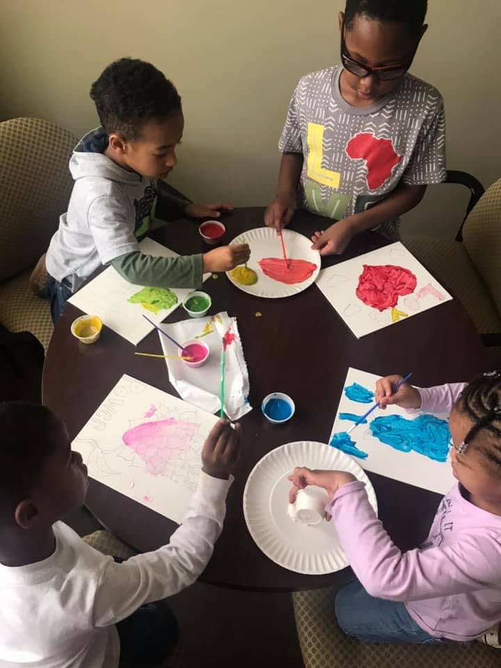 Children painting at a table