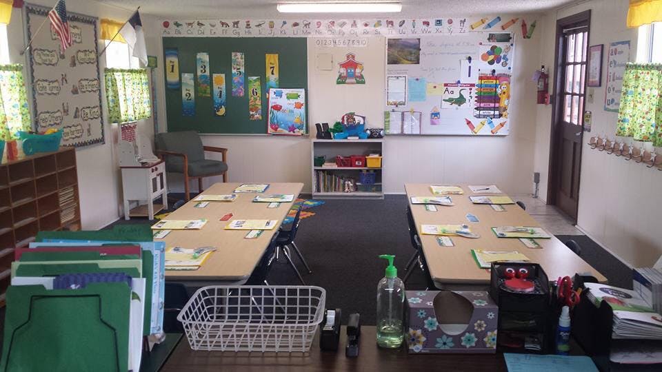 Classroom with two long tables set up for students