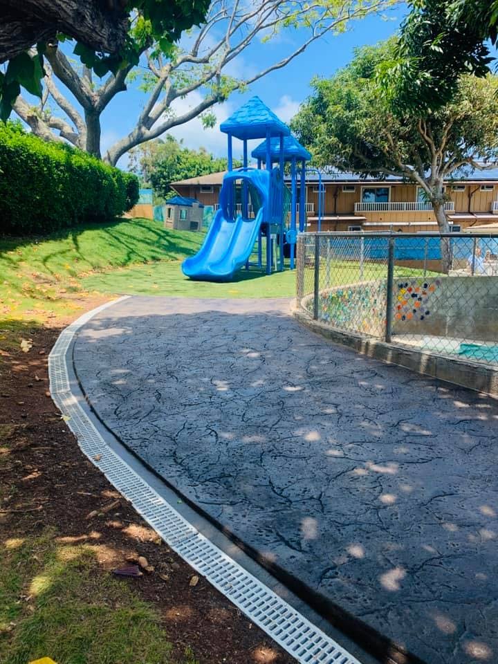 Playground with blue slide and climbing structure