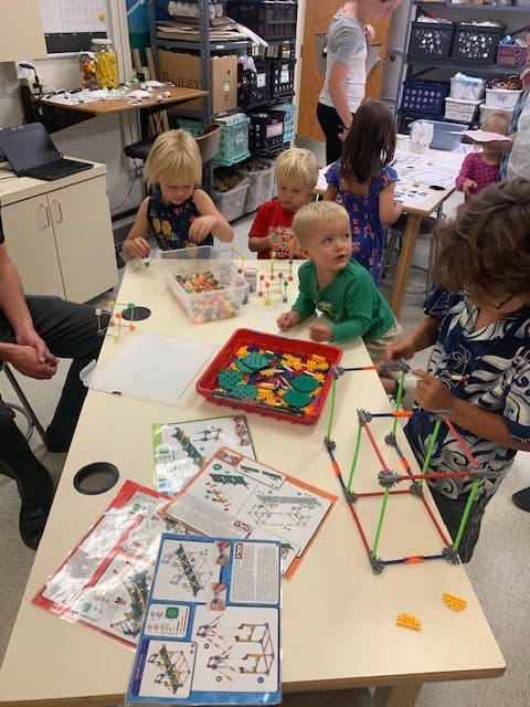 Children building with construction toys at a table
