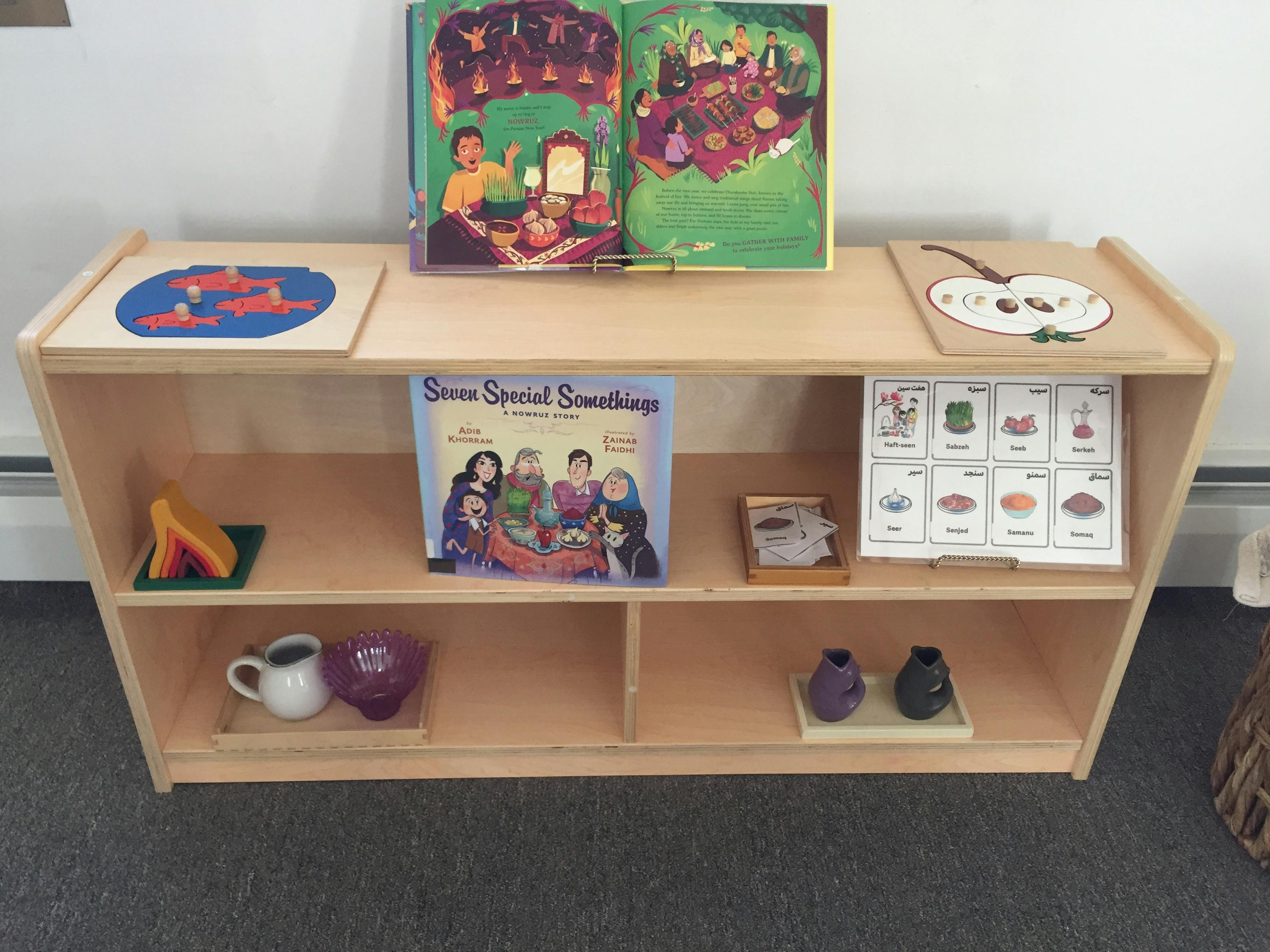 Wooden shelf with books, puzzles, and small objects