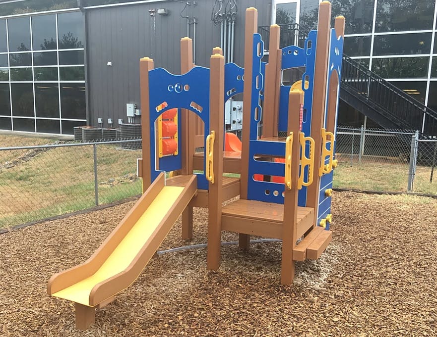 Playground structure with a slide