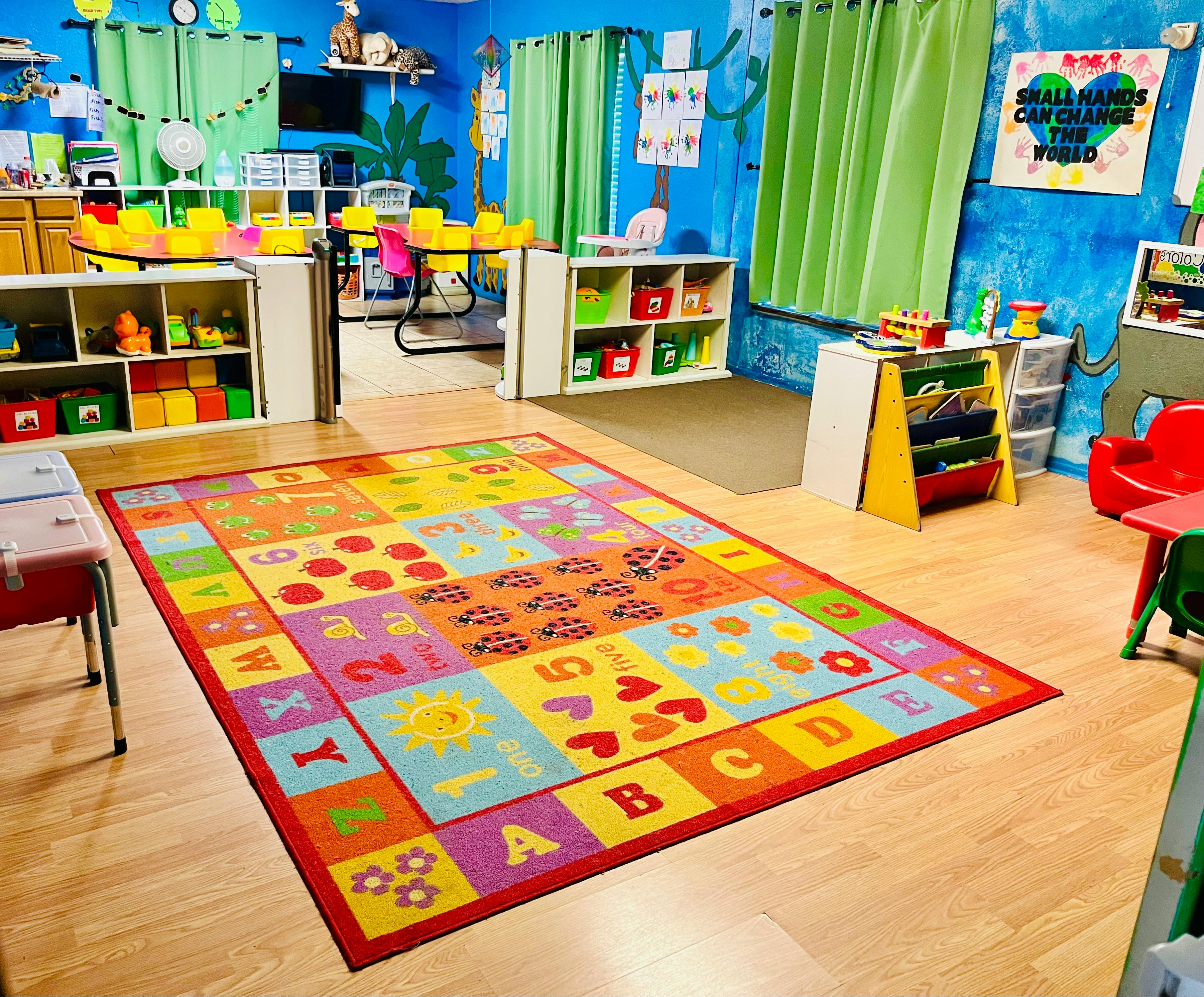Colorful alphabet and number rug in a classroom