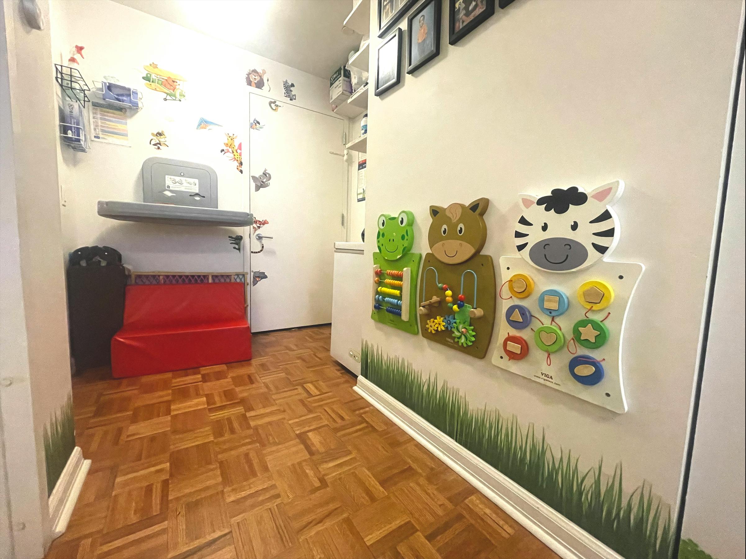 Hallway with animal-themed activity boards on the wall