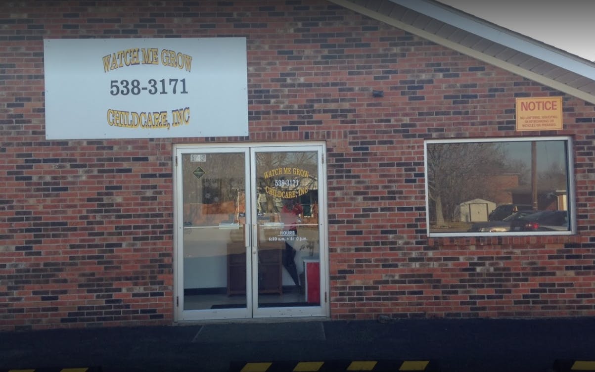 Brick building with a sign and glass doors
