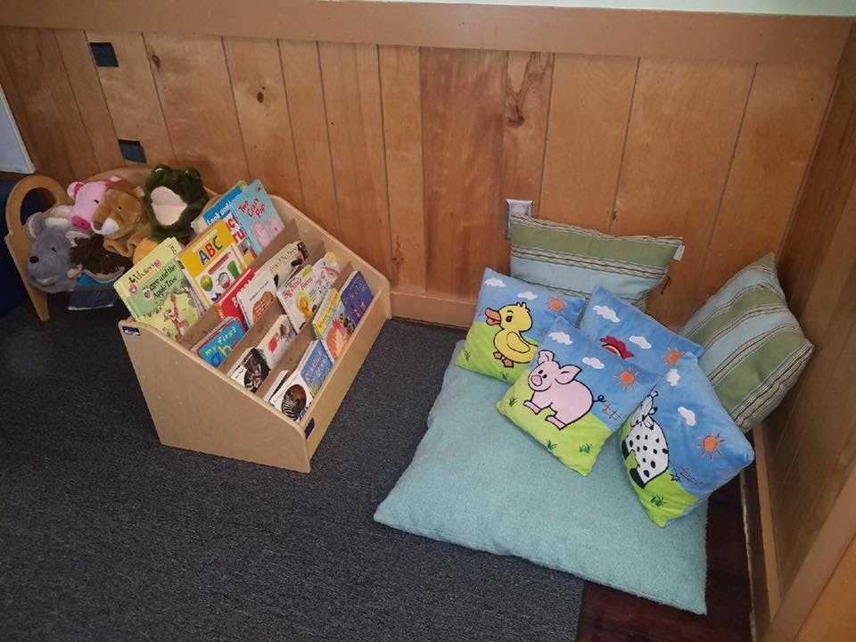Children's book display and floor cushions