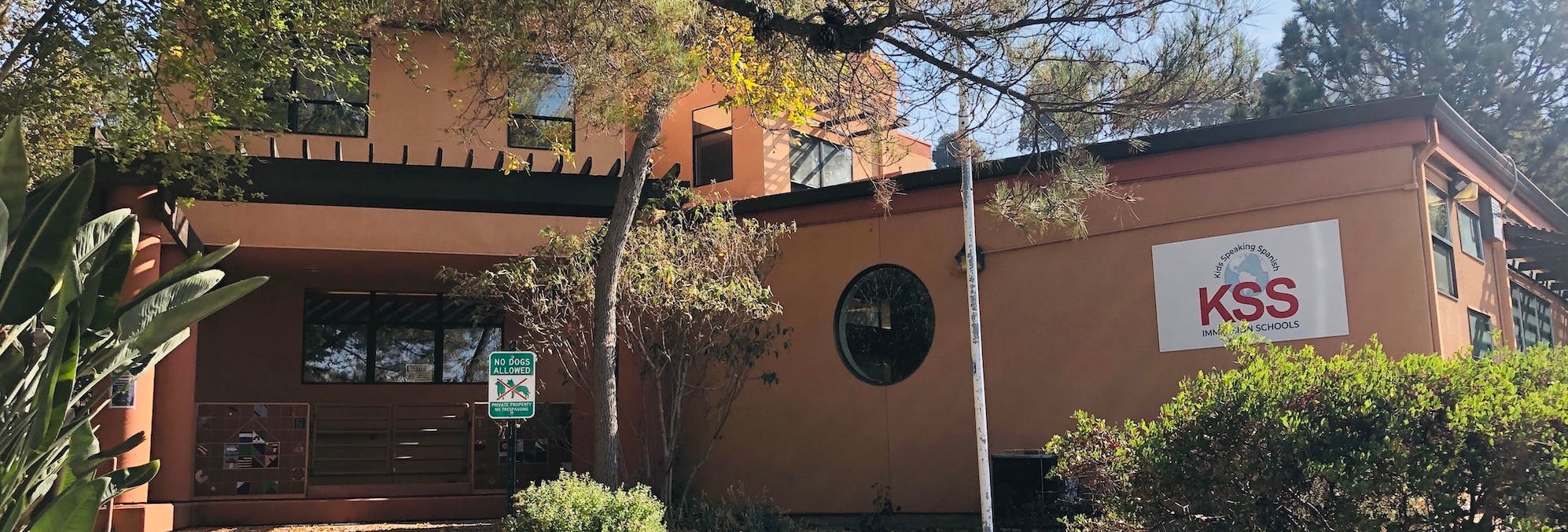 Building exterior with a KSS sign on the side