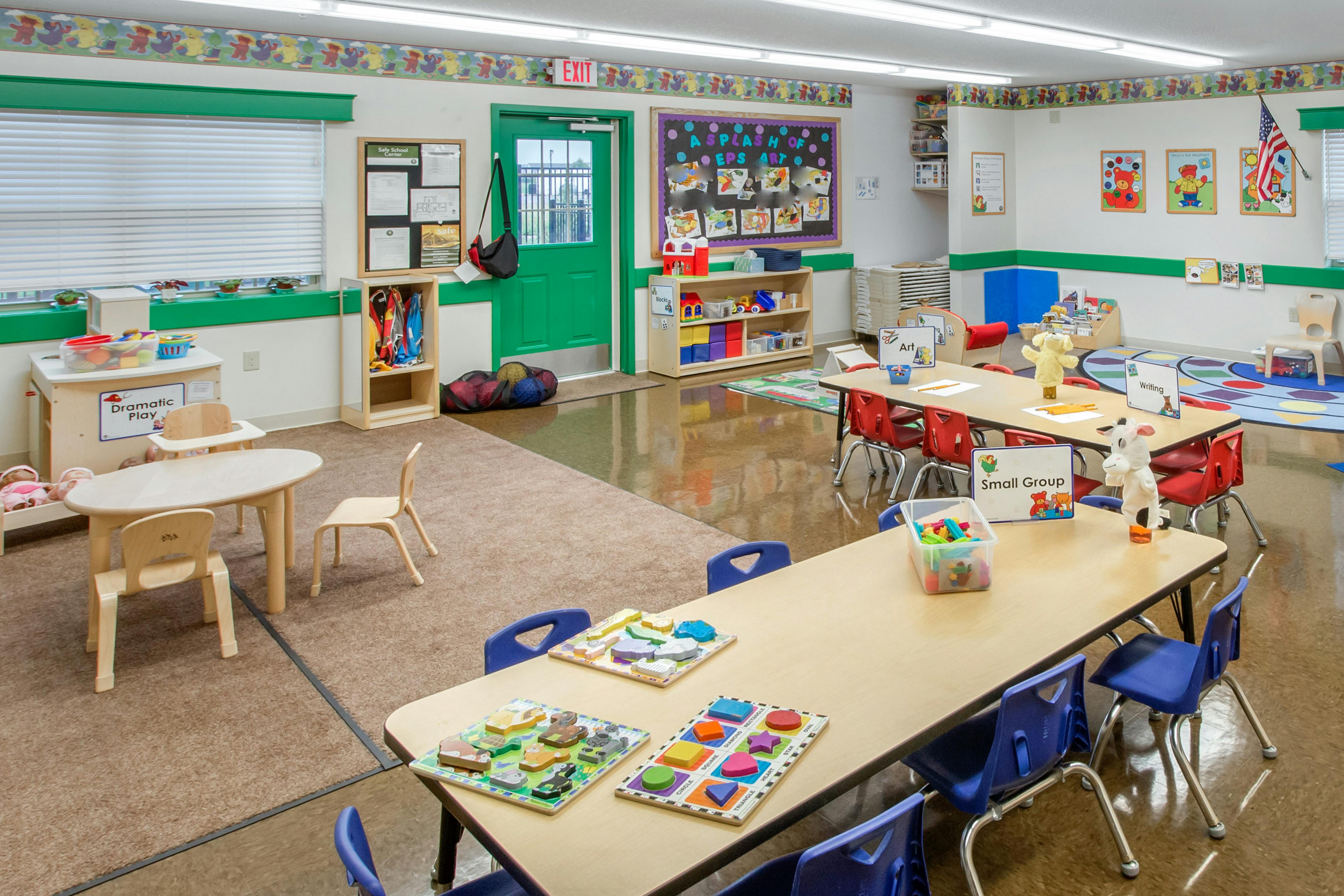 Classroom with tables, chairs, and play areas
