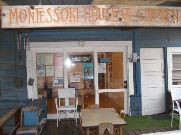 Montessori House of Children sign above a building entrance