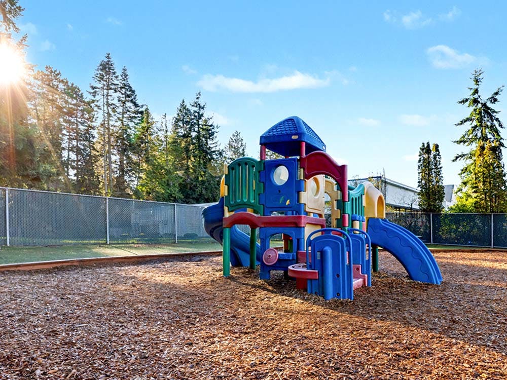 Colorful playground structure on wood chips