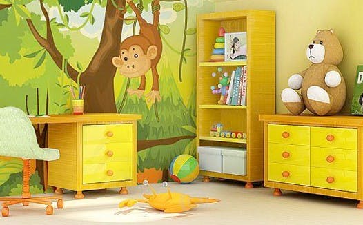 Child's room with yellow desk, bookshelf, and dresser, jungle mural