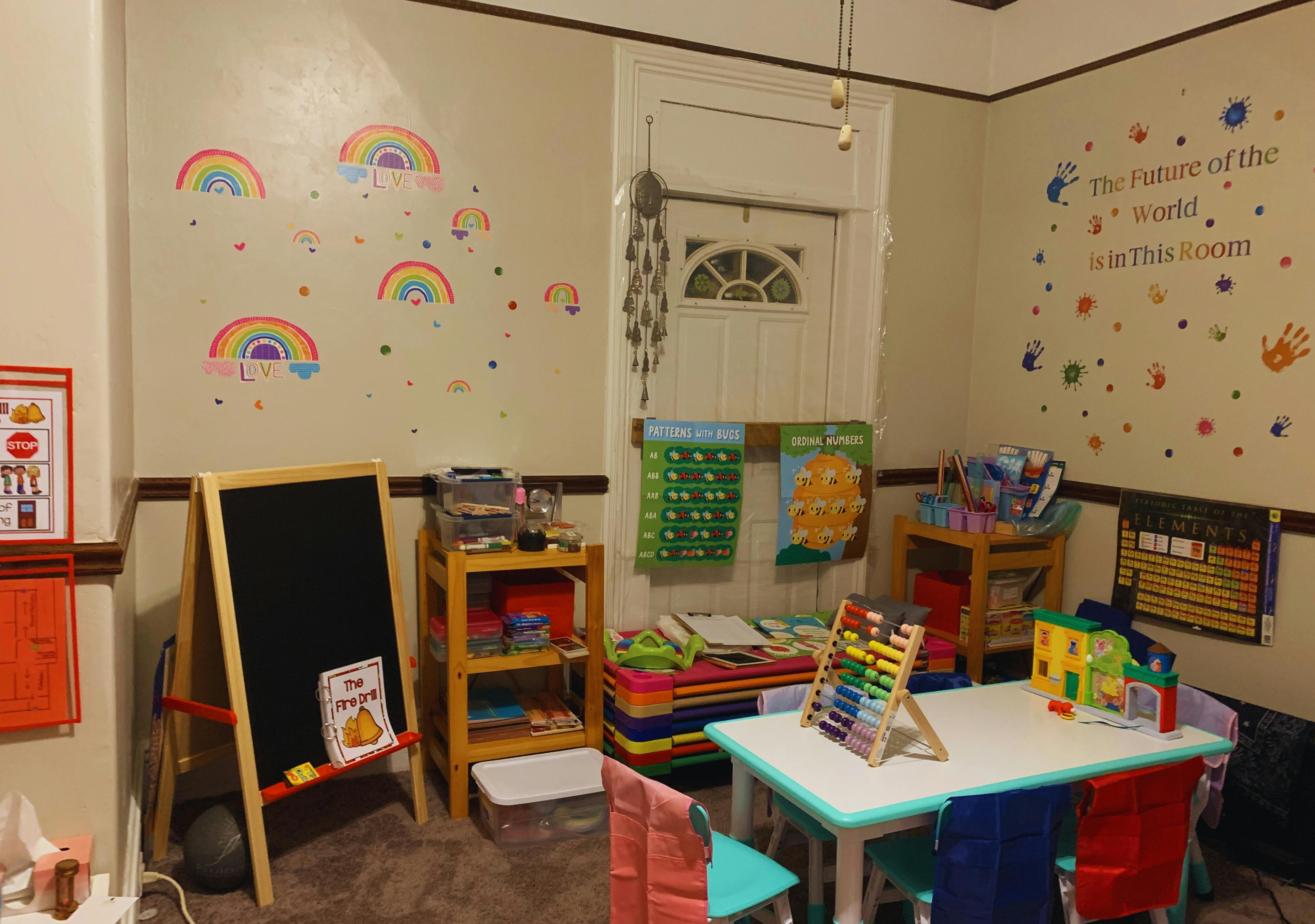 Classroom interior with children's furniture learning charts and wall decorations