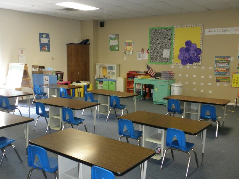 Empty classroom with desks and chairs