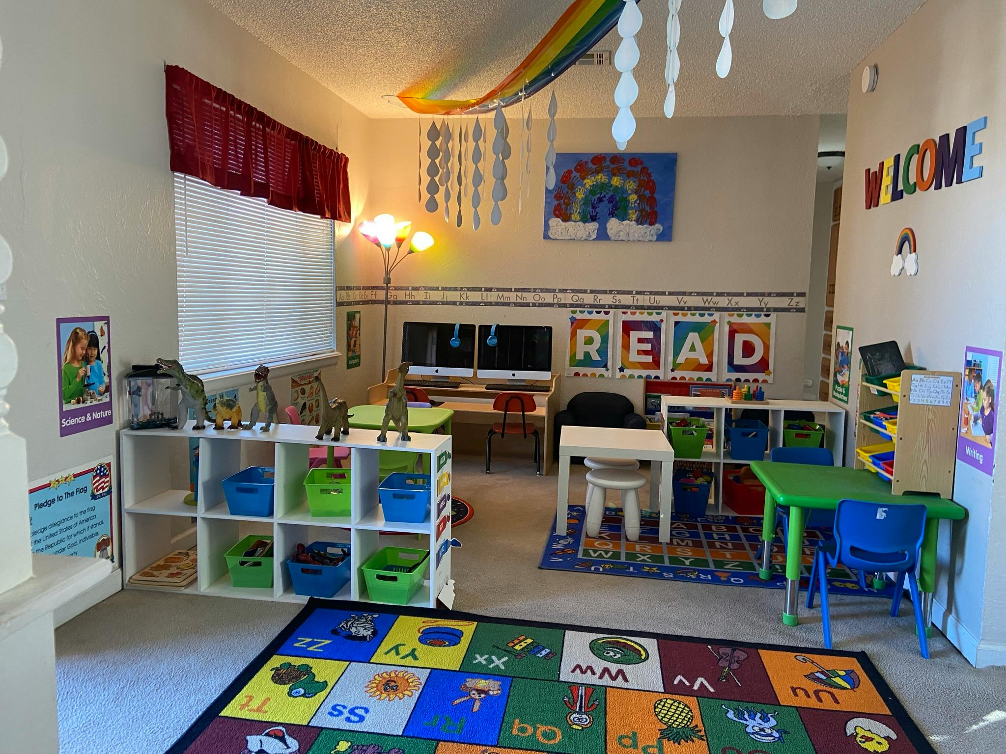 A colorful classroom with small tables, chairs, and storage shelves