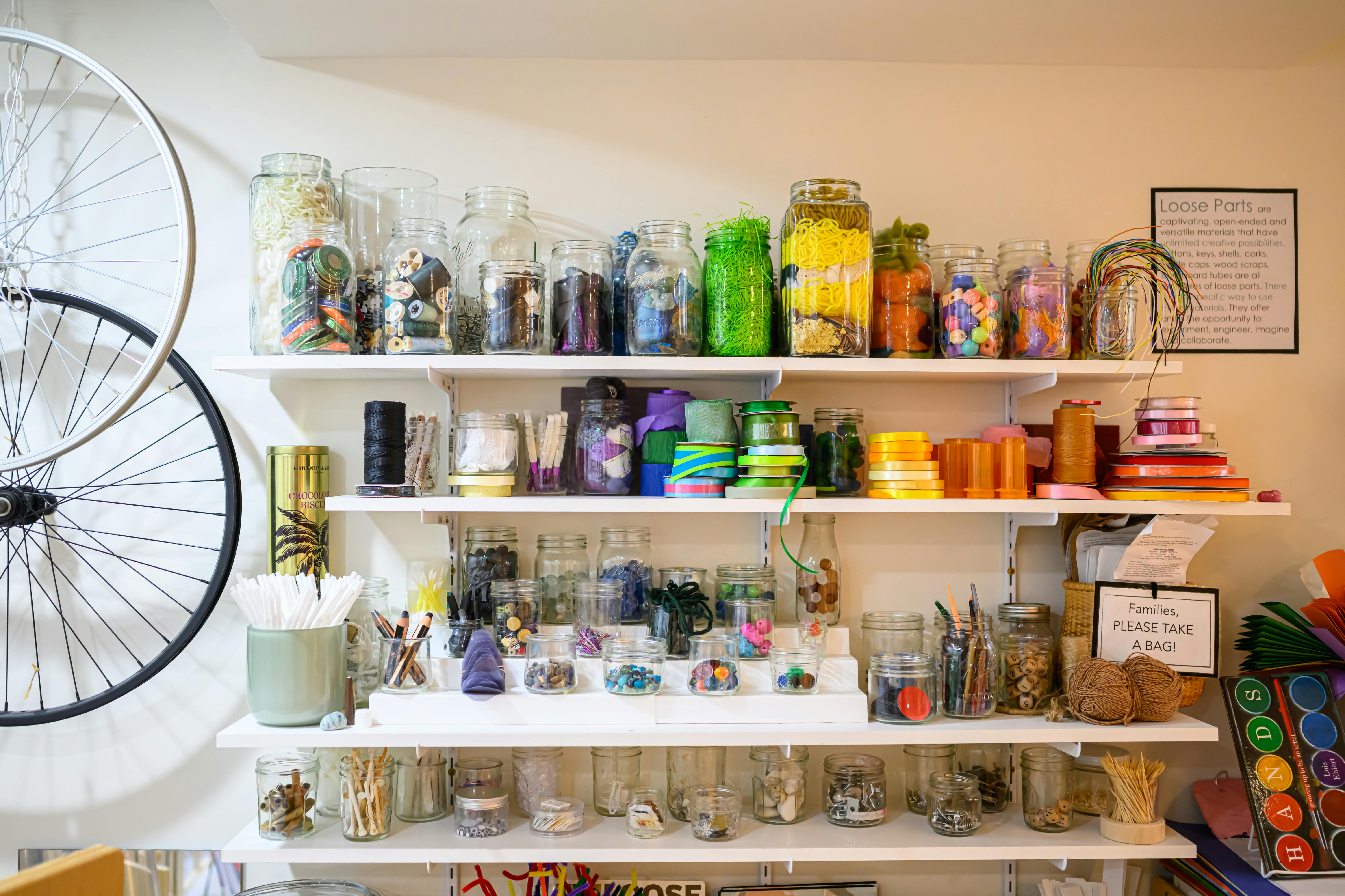 Shelves filled with various craft supplies and jars
