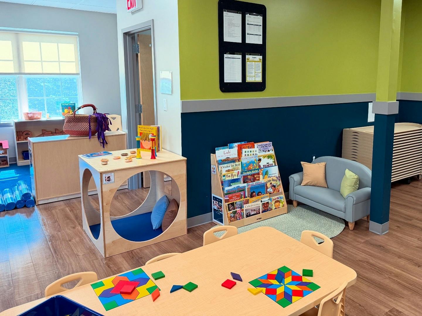 Classroom with a table, chairs, and a small couch
