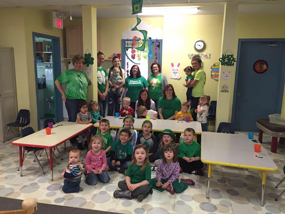 Group of adults and children in a classroom