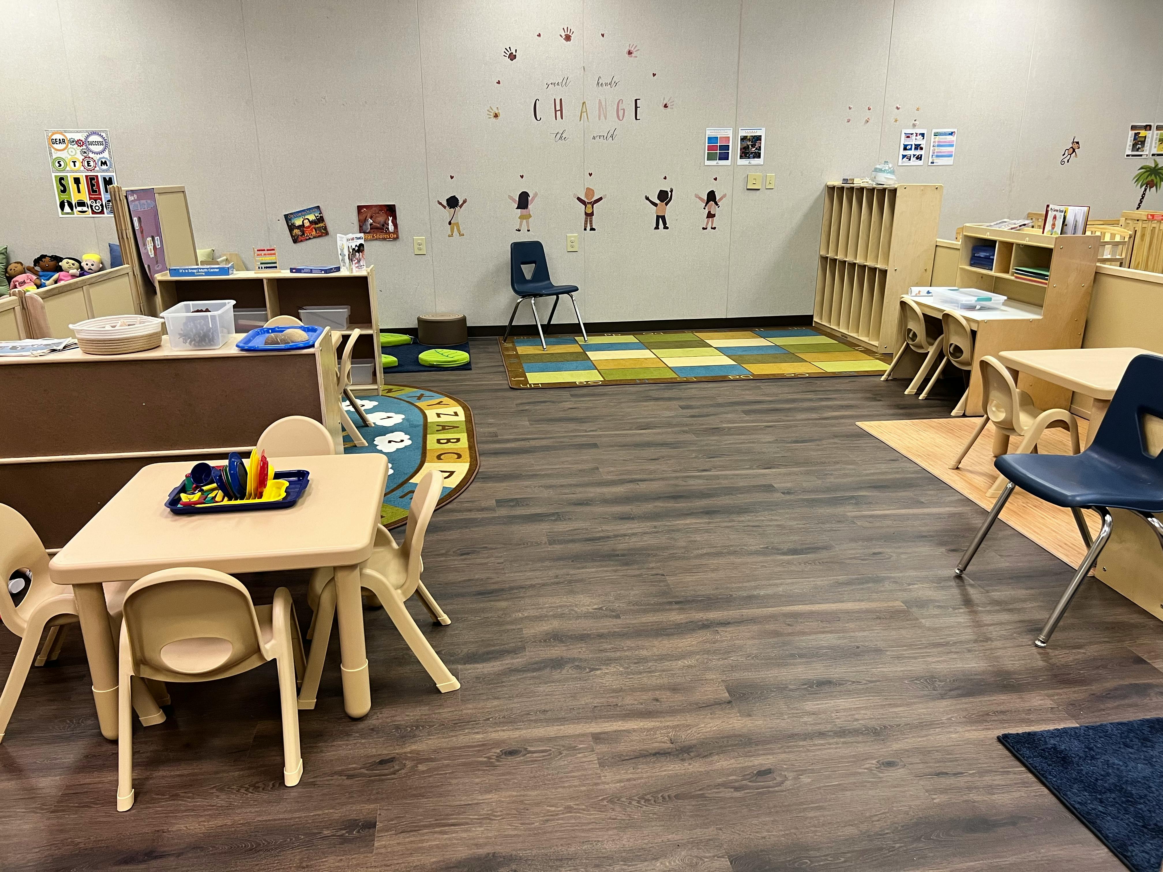 Empty classroom with small tables and chairs